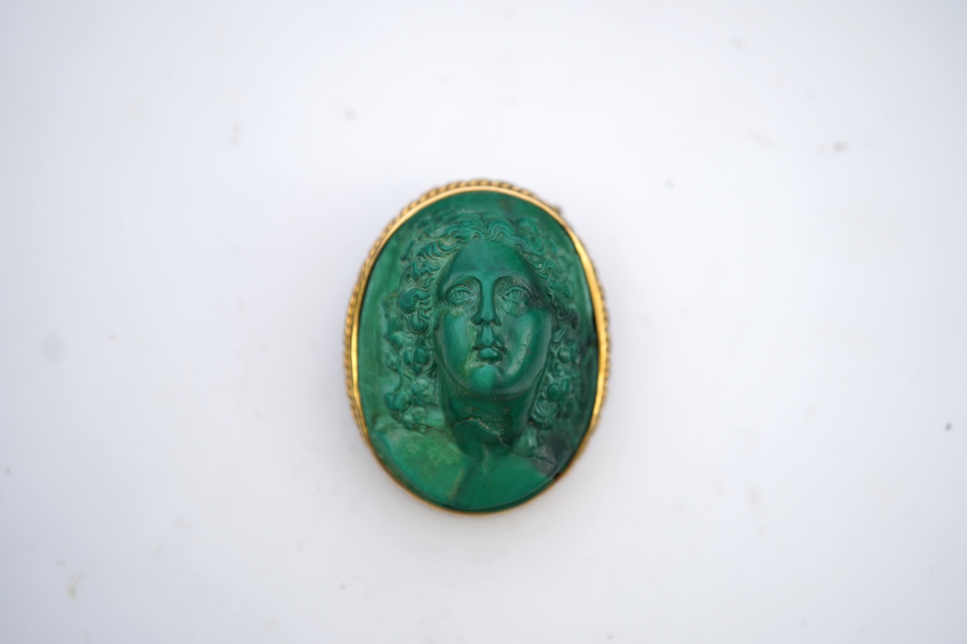 A malachite cameo brooch, mid 19th century